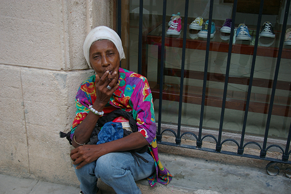 A Cuban woman smoking cigar in Old Havana.