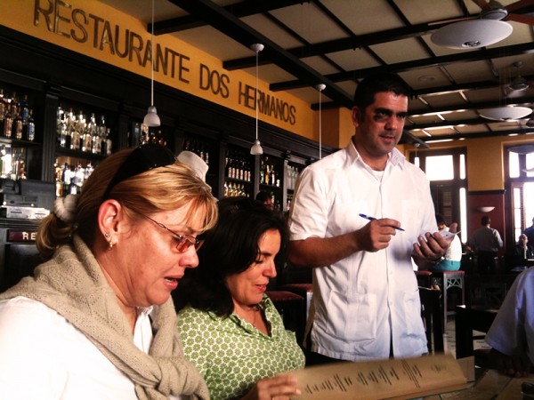 Customers ordering food in a Cuban restaurant 